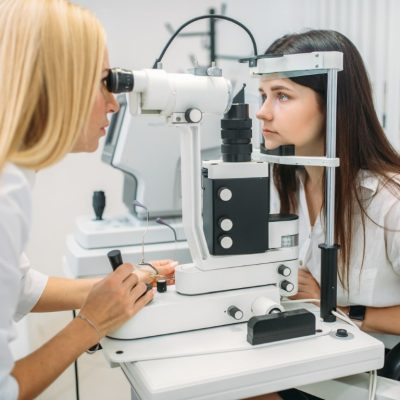 Eyesight test in optician cabinet, choice of lens